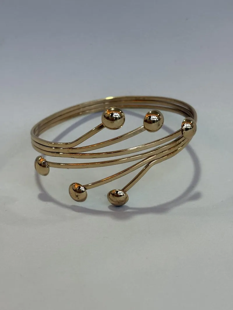 Brazalete dorado bolas